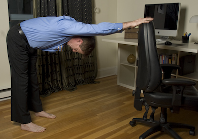 Downward Facing Dog (using chair) - Innergy Corporate Yoga Inc.